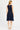 En Saison Pleated Knit Mini Dress in Navy - Estilo Boutique