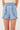Hayden Girls Smocked Waist Ruffled Shorts in Light Denim