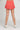 Gold Hinge Pleated Tennis Skirt in Dark Coral - Estilo Boutique