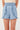Hayden Girls Smocked Waist Ruffled Shorts in Light Denim